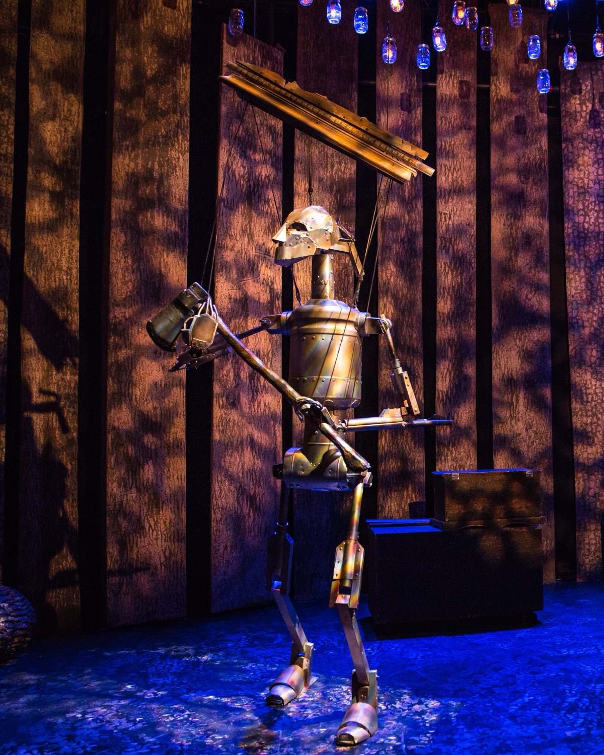 The Tin Man puppet on stage in The Woodsman